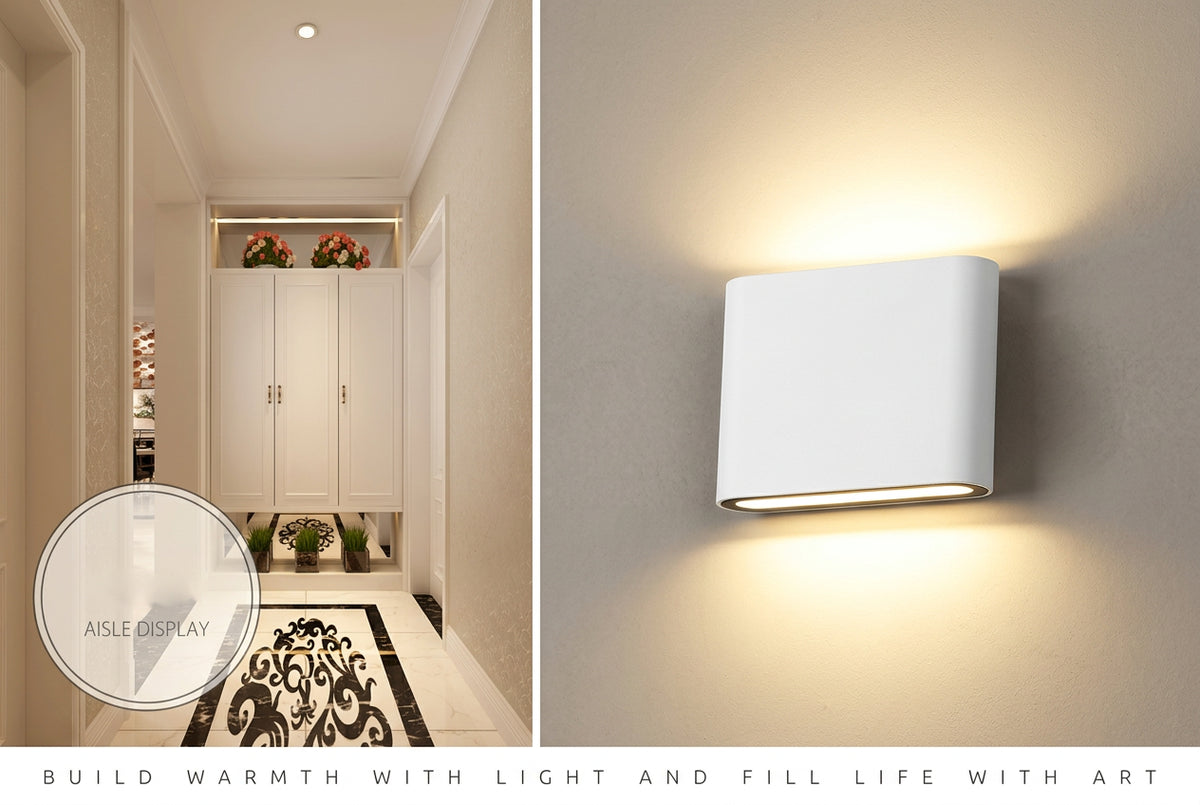 Modern hallway with wall-mounted light fixture and decorative elements.