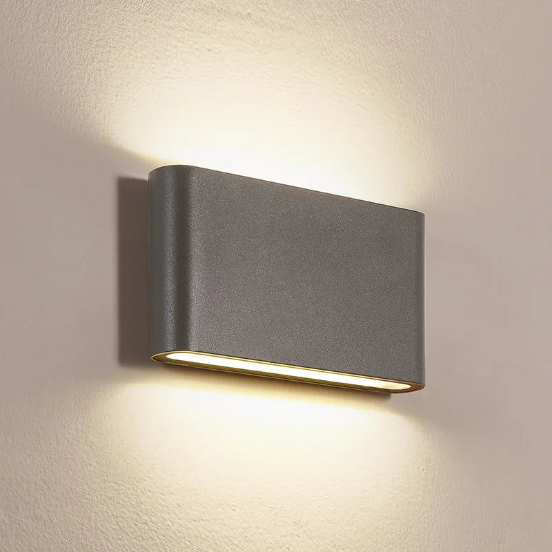 Modern outdoor wall light fixture on a neutral wall