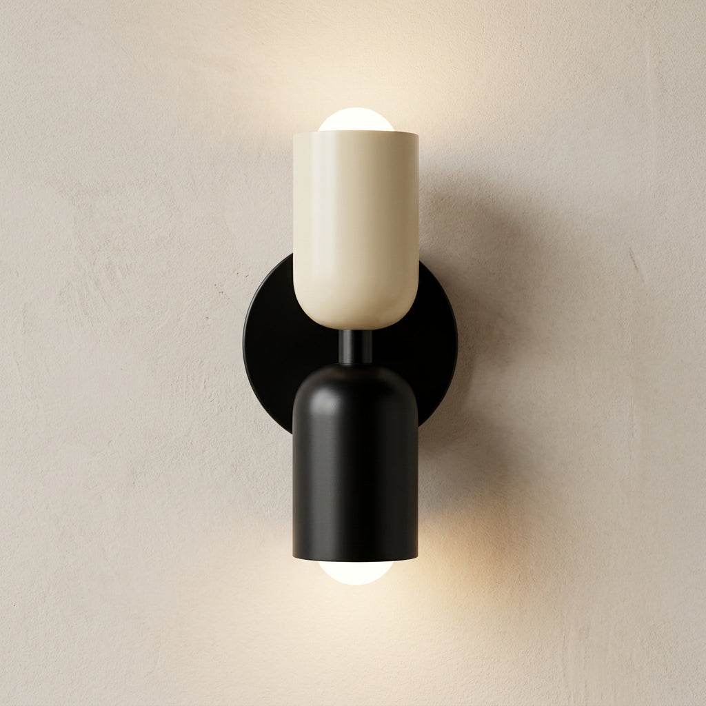 Modern wall sconce with black base and white shade on a light gray background