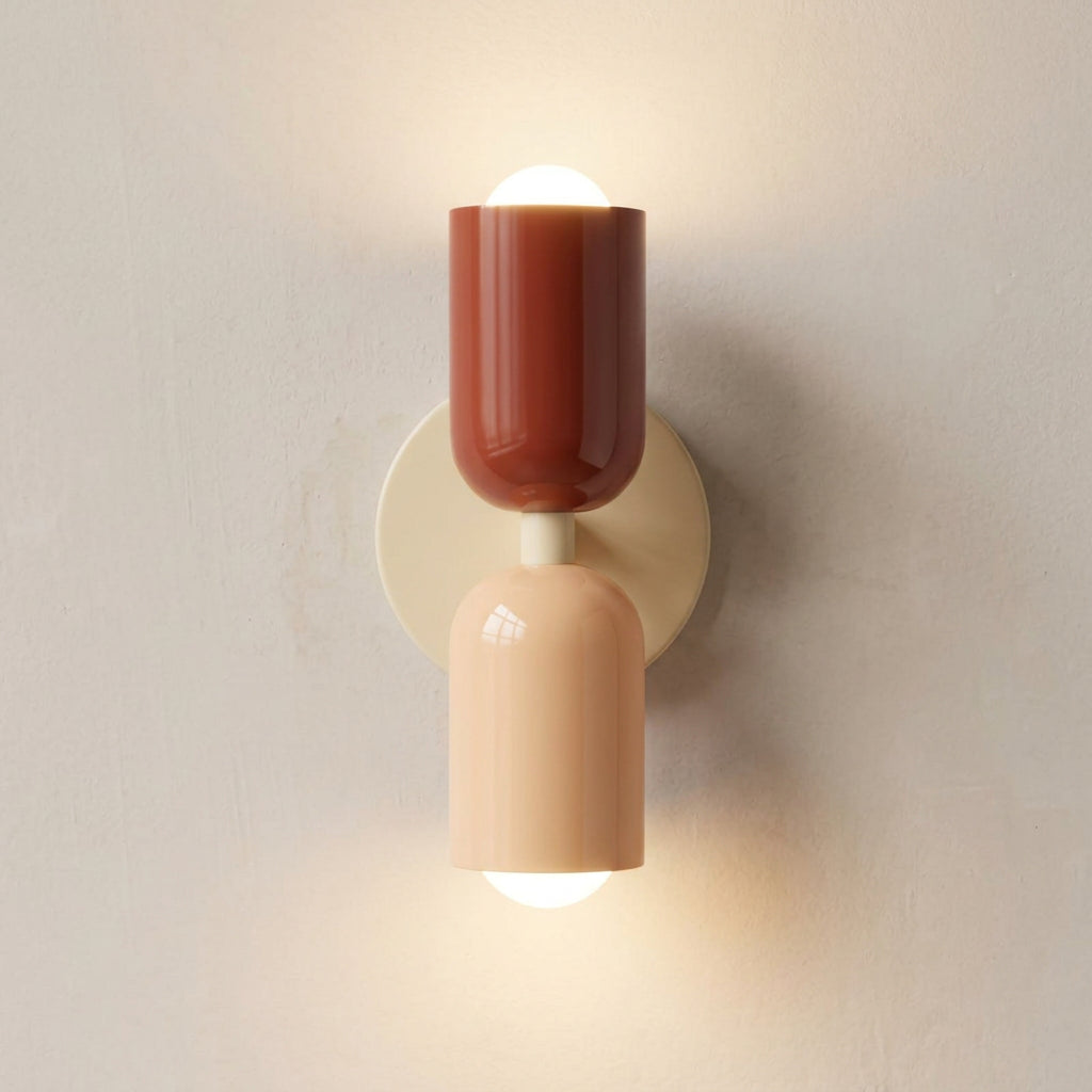 Wall-mounted light fixture with two-tone design on a plain background
