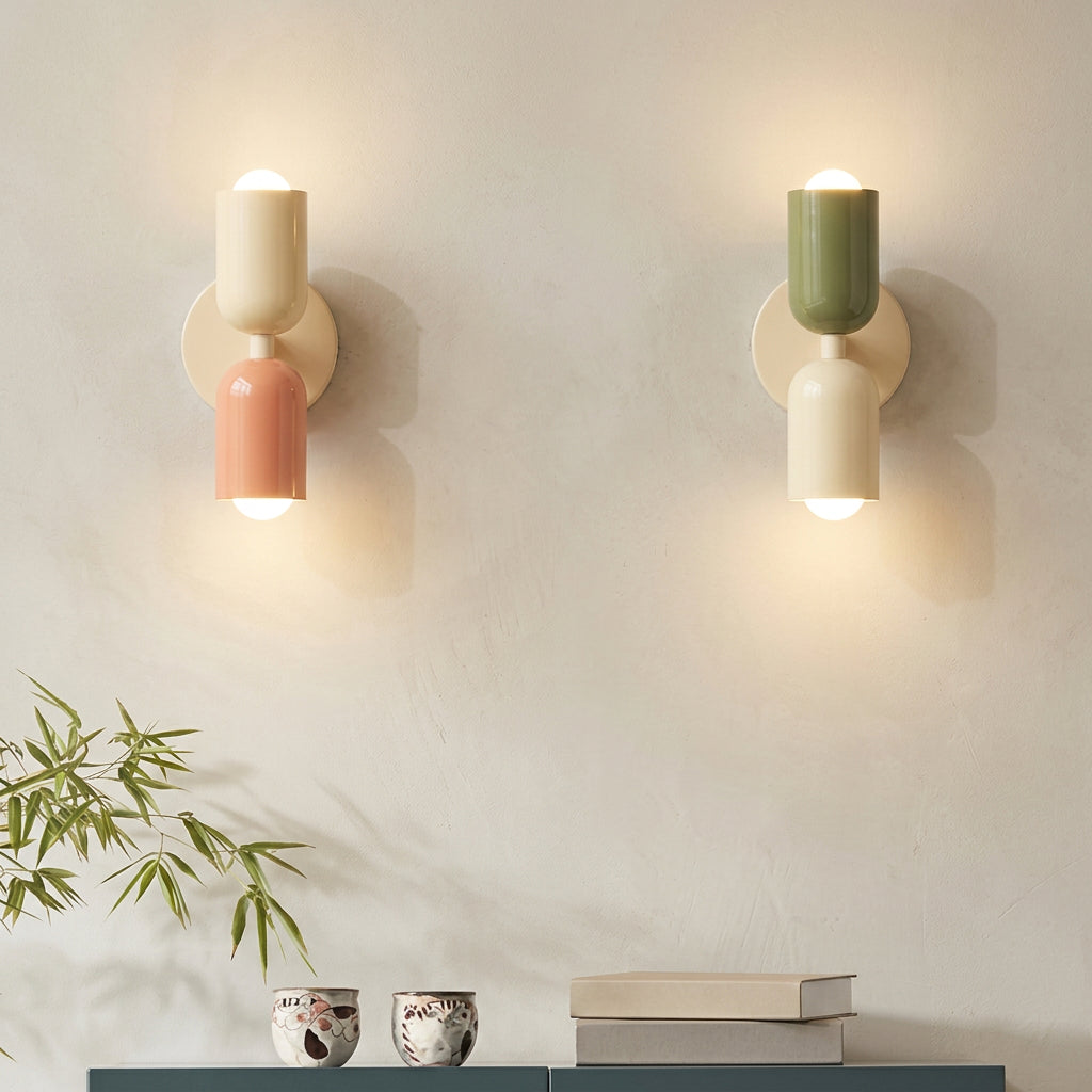 Two wall-mounted lamps with colorful bases on a gray wall, featuring text about healthy and comfortable lighting.