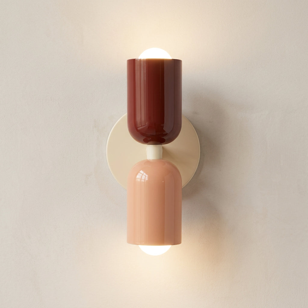 Two-tone wall sconce with red and beige design on a white background